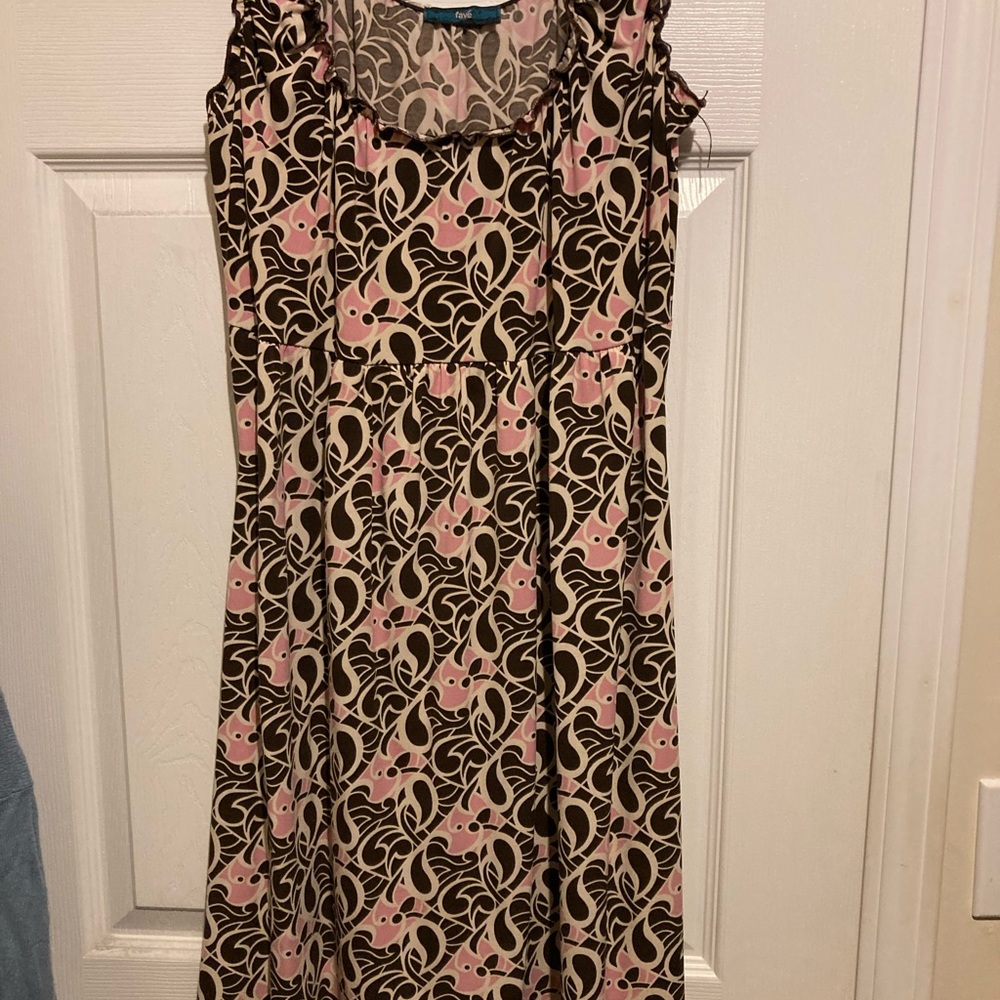 Lightly worn thin dress floral type pattern.